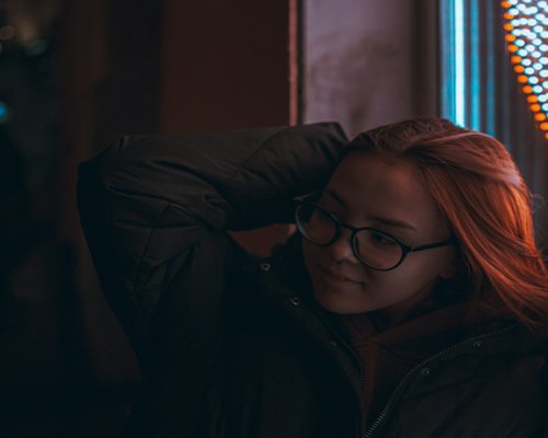 A person leaning back and resting their eyes